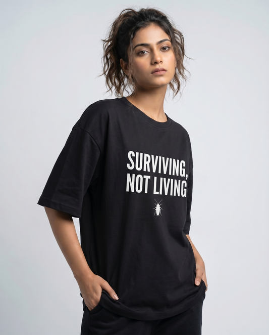 SURVIVING NOT LIVING — Oversized Black Tee | Cockroach Janta Party