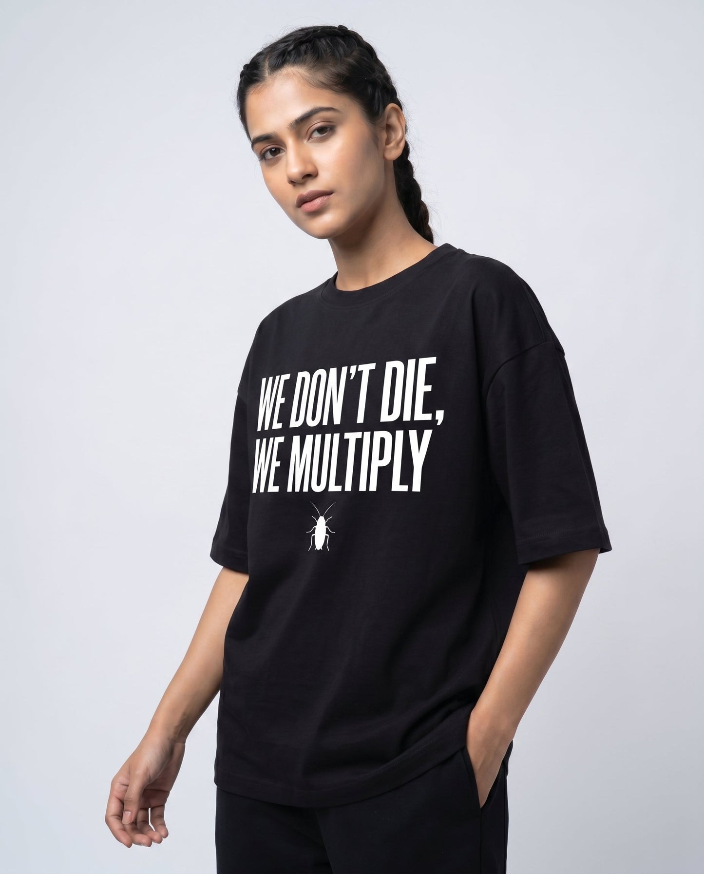 WE DON'T DIE WE MULTIPLY — Oversized Black Tee | Cockroach Janta Party