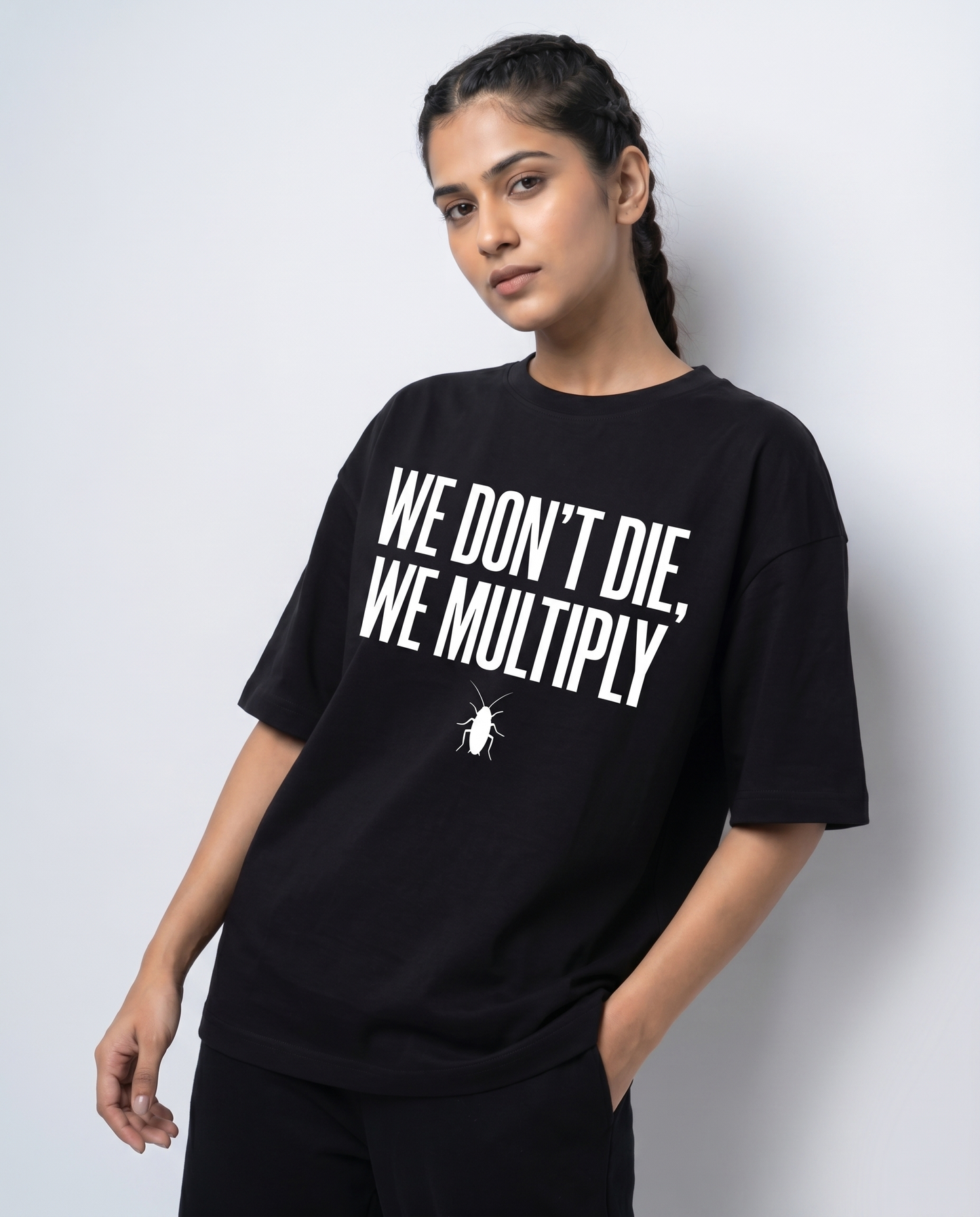 WE DON'T DIE WE MULTIPLY — Oversized Black Tee | Cockroach Janta Party