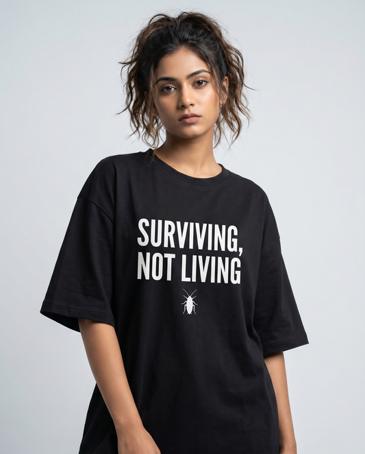 SURVIVING NOT LIVING — Oversized Black Tee | Cockroach Janta Party