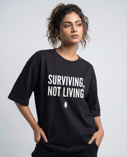 SURVIVING NOT LIVING — Oversized Black Tee | Cockroach Janta Party