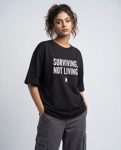 SURVIVING NOT LIVING — Oversized Black Tee | Cockroach Janta Party