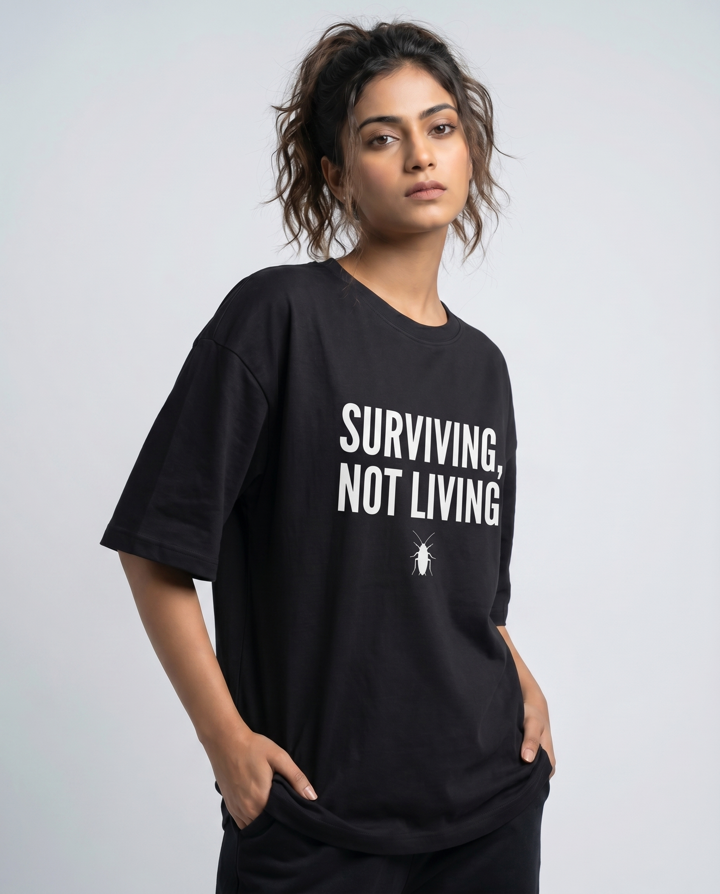 SURVIVING NOT LIVING — Oversized Black Tee | Cockroach Janta Party